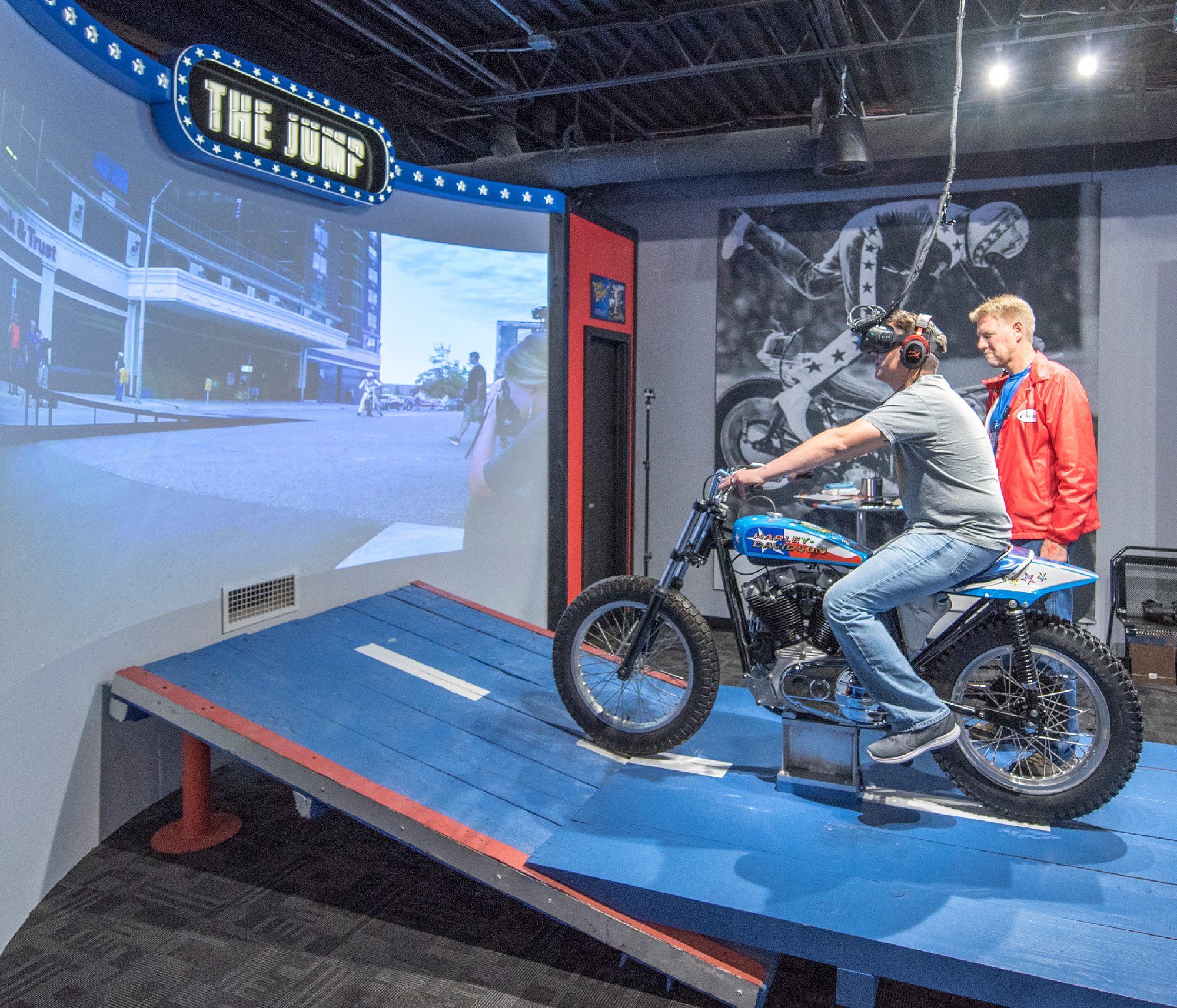 Guest on the motorcycle ramp of the 4D VR jump simulator
